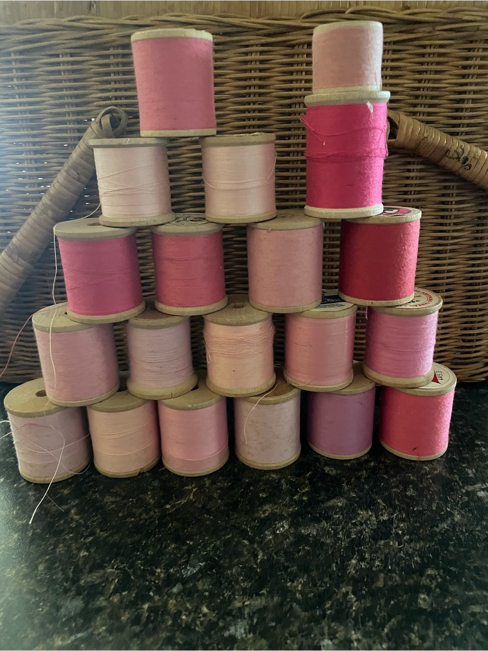 Vintage spools of pink shades of thread.